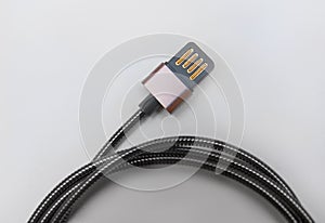 Black metal USB charging cable for smartphone isolated on white
