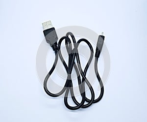 Black micro USB cable, isolated on the gray white background. Cable connector micro-USB to USB