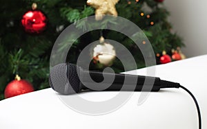 Black microphone with christmas tree