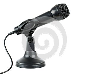 A black microphone at a low angle on a stand