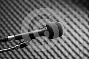 Black microphone in studio booth