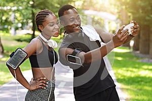 Black Millennial Couple Taking Selfie On Smartphone While Doing Sport Together Outdoors