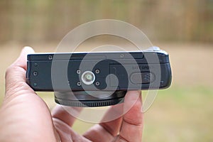 a black mirrorless camera  on blurred background