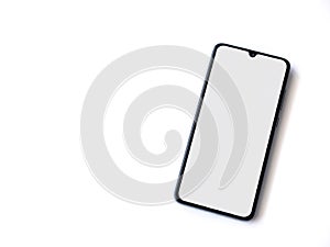 Black mobile smartphone mockup lies on the surface with blank screen isolated on white background