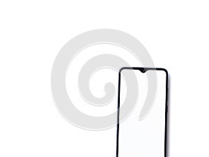 Black mobile smartphone mockup lies on the surface with blank screen isolated on white background