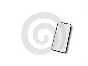 Black mobile smartphone mockup lies on the surface with blank screen isolated on white background