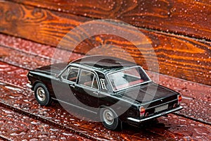 Black model limousine on mahagony boards photo