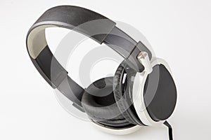 Black modern headphone on grey backgound