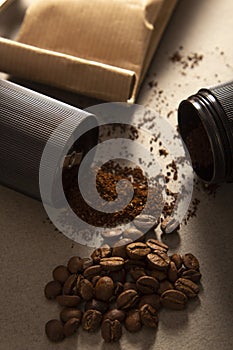 Black modern manual coffee grinder and beans