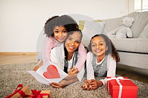 Black Mommy And Daughters Celebrating Mother& x27;s Day Holiday Together Indoors
