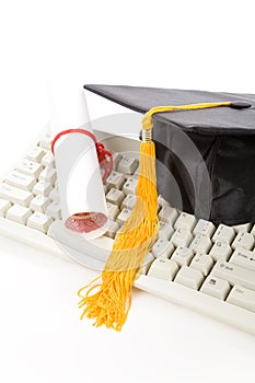 Black Mortarboard and computer keyboard