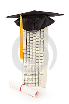 Black Mortarboard and computer keyboard