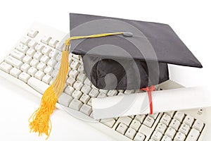 Black Mortarboard and computer keyboard