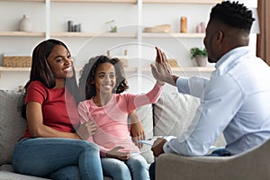 Black mother and daughter at the appointment with a psychologist