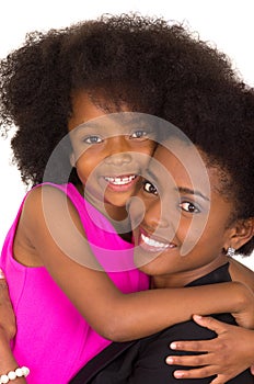 Black mother daughter posing happily