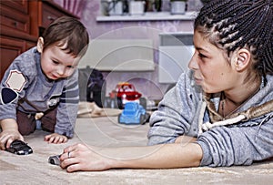 Black mother, little son, play with cars, happy family, non-stand