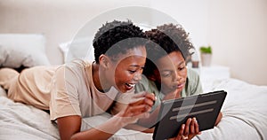 Black mother, smile and kid on tablet in bedroom, learning or watch funny cartoon. African children, tech and mom on bed