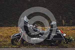 Black motorcycle bagger on roadside