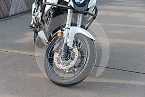 Black motorcycle on the running board parked