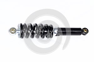 Black motorcycle shock absorber on white