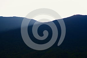 Black mountain in sunlight