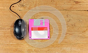 Black Mouse computer and floppy disk