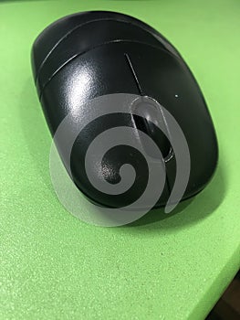 Black mouse at the green background
