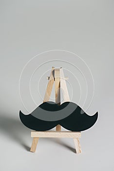 Black moustache on an easel