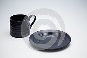 Black mug and saucer