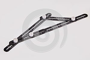 Black multi function Ruler isolated on white background.