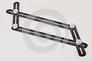 Black multi function Ruler isolated on white background.