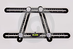 Black multi function Ruler isolated on white background.