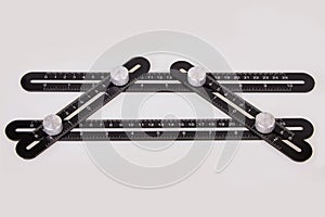 Black multi function Ruler isolated on white background.