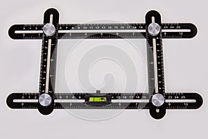 Black multi function Ruler isolated on white background.