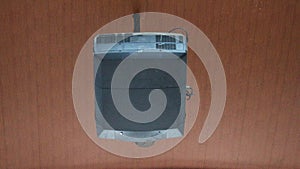 black multimedia projector hanging from a ceiling mount