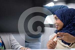 Black muslim female software developer at work