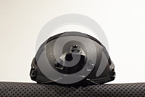 Black nato military helmet on white background