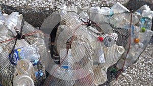 The black net bag full of plastic bottles in Koijigahama Beach in Tahara Japan