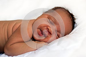 Black newborn baby sleeping soundly