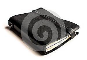 Black notebook with leather covers in perspective