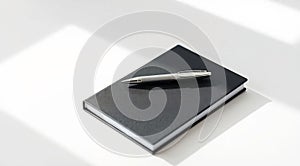 Black Notebook with Silver Pen