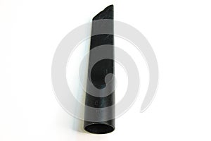 Black nozzle for vacuum cleaner on a white background. Carpet and floor purifier narrow parts and accessories.