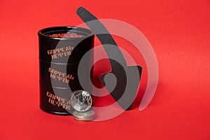 Black oil barrel with a one ruble coin and down arrow on a red background