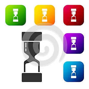 Black Old hourglass with flowing sand icon isolated on white background. Sand clock sign. Business and time management