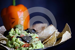 Black Olive Spiders and Sick Bell Pepper Jack O Lantern With Guacamole