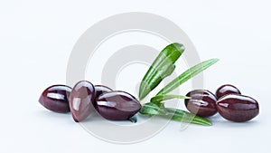 Black Olives with Green Leaves Composition Isolated On White Background