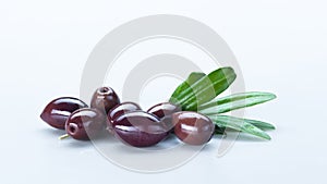 Black Olives with Green Leaves Composition Isolated On White Background