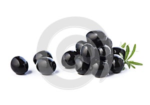 Black olives with leaves on white backgrounds