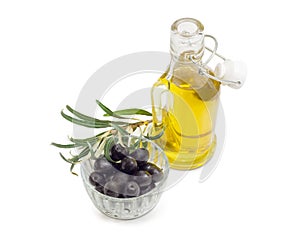 Black olives, olive oil and olive branch