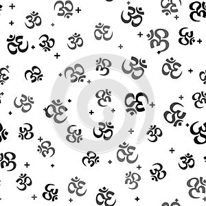 Black Om or Aum Indian sacred sound icon seamless pattern on white background. Symbol of Buddhism and Hinduism religion